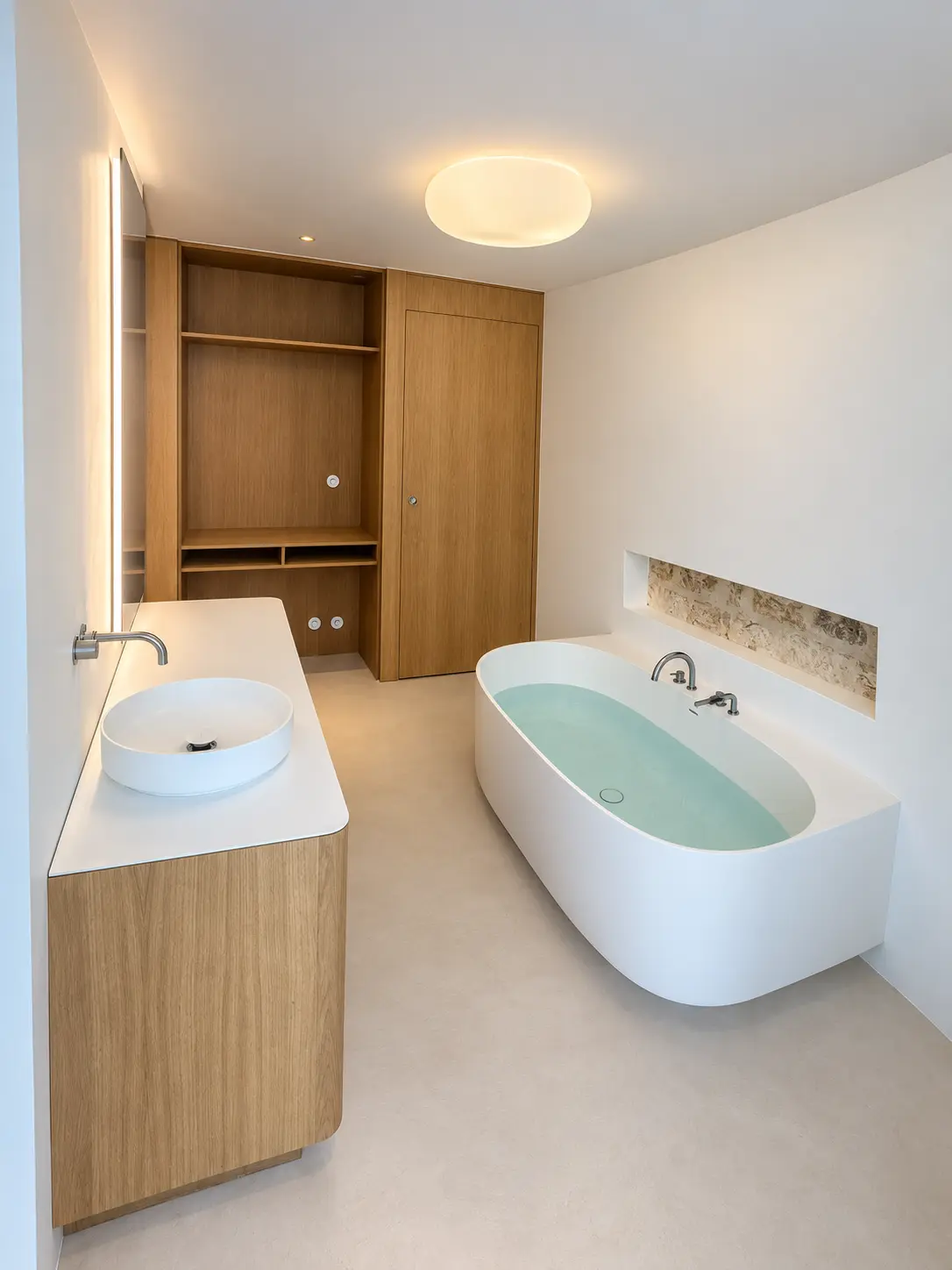 Blue Gold Control bathroom project with freestanding bath and stone niche
